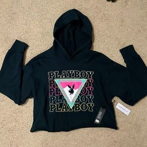 Black cropped playboy hoodie with design on front, size extra small